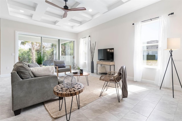 living room featuring coffered ceiling, light tile floors, ceiling fan, and beam ceiling