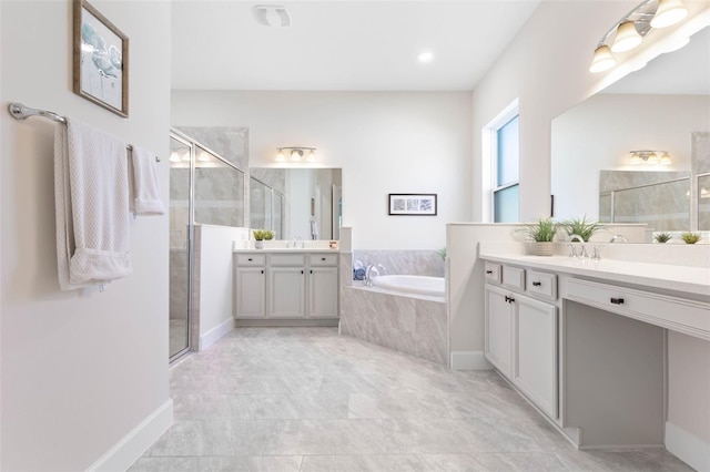 bathroom with tile flooring, large vanity, and separate shower and tub