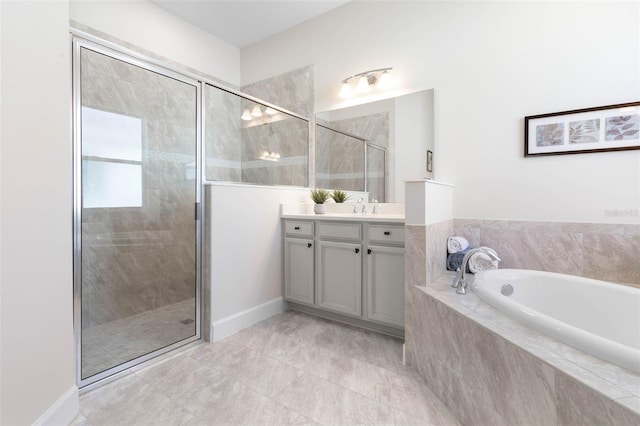 bathroom featuring tile flooring, oversized vanity, and separate shower and tub