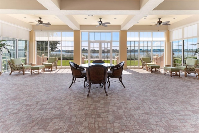 sunroom with beam ceiling, coffered ceiling, and ceiling fan