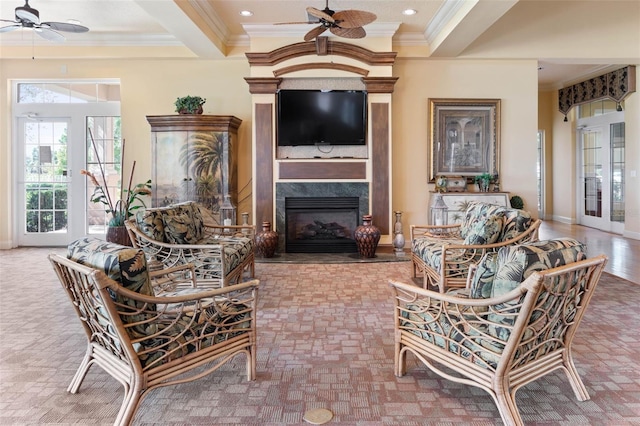 living room with ceiling fan, french doors, and crown molding