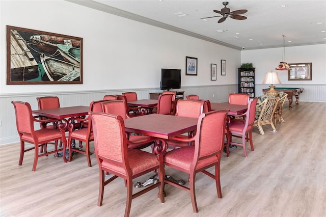 dining area featuring billiards, light hardwood / wood-style floors, ceiling fan, and ornamental molding