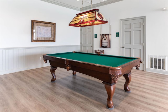 playroom with pool table, ornamental molding, and light wood-type flooring