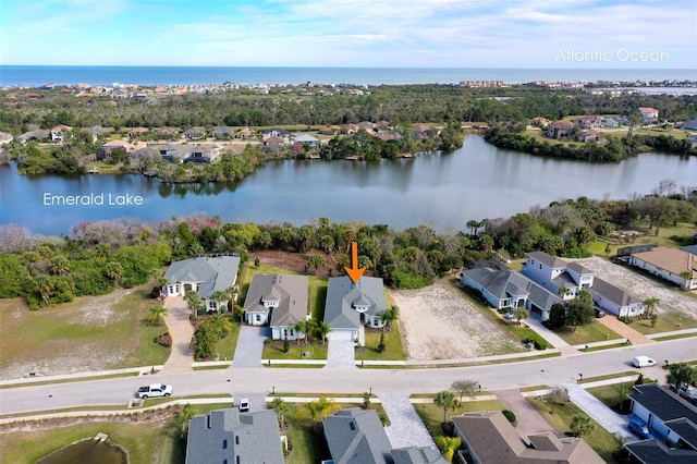 birds eye view of property featuring a water view