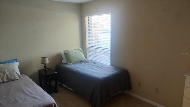 bedroom featuring dark carpet