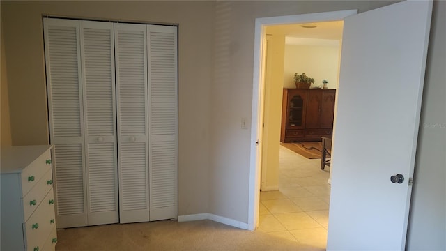 tiled bedroom featuring a closet