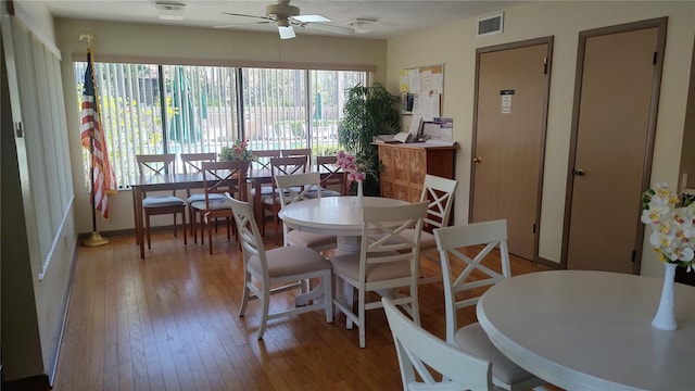 dining space featuring ceiling fan and light hardwood / wood-style flooring