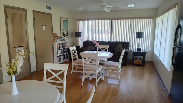 dining area featuring hardwood / wood-style floors, ceiling fan, and a wealth of natural light