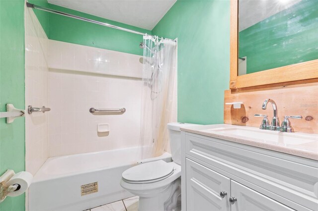 full bathroom with tile floors, shower / tub combo with curtain, vanity with extensive cabinet space, and toilet