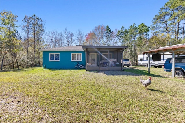 view of front of property with a sunroom and a front yard