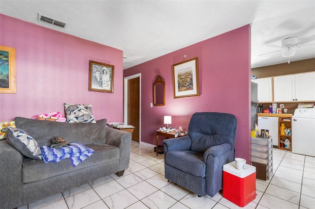 living room with ceiling fan, washer / clothes dryer, and visible vents