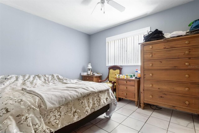 bedroom featuring a ceiling fan and light tile patterned flooring