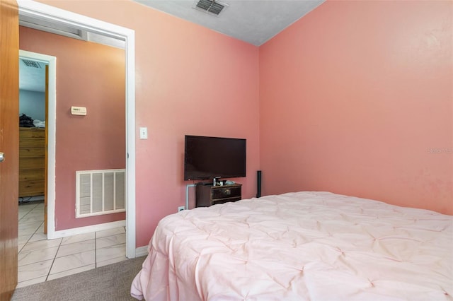 bedroom featuring visible vents and baseboards