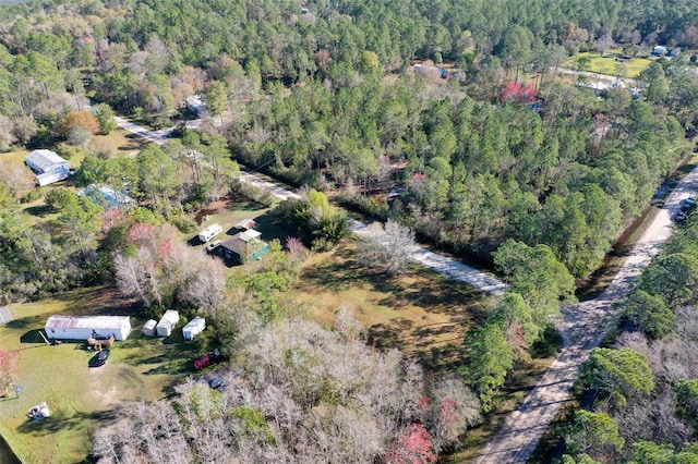 bird's eye view featuring a forest view