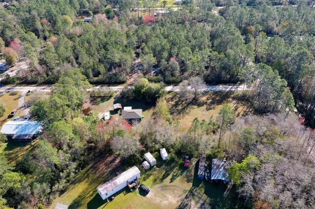 bird's eye view featuring a wooded view