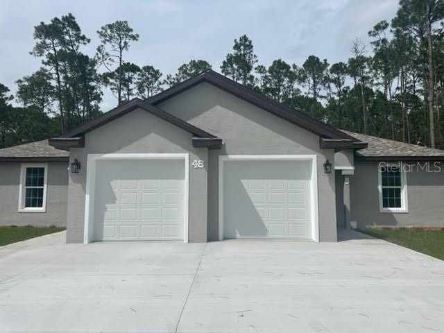 single story home with a garage