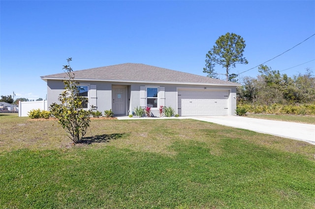 ranch-style house featuring a front lawn and a garage