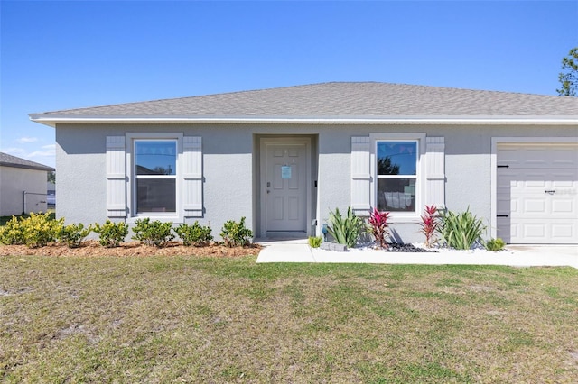 ranch-style home with a front lawn and a garage