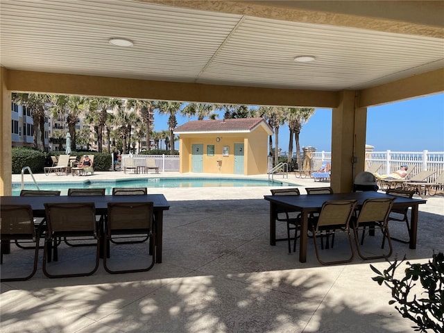 view of terrace with a community pool