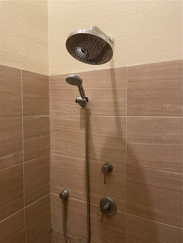 details featuring a tile shower