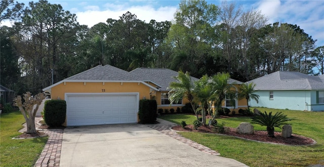 single story home featuring a front yard and a garage