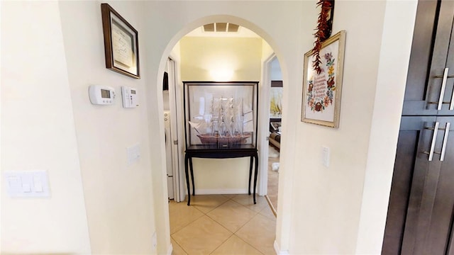 hall with light tile flooring