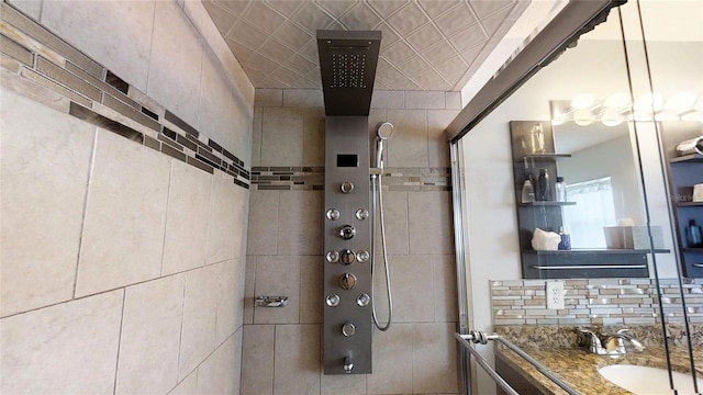 bathroom with tile walls and large vanity