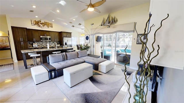 living room featuring high vaulted ceiling, light tile flooring, and ceiling fan