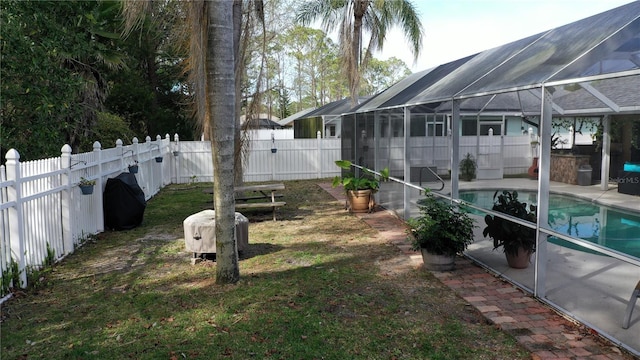 view of yard with a patio, glass enclosure, and a fenced in pool