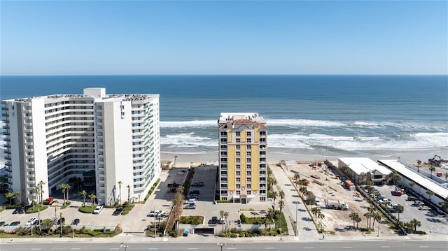 bird's eye view with a view of the beach and a water view