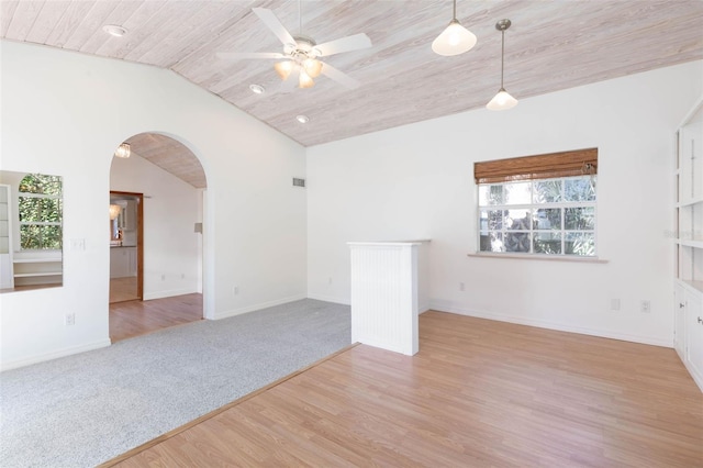 spare room with plenty of natural light, light hardwood / wood-style floors, and ceiling fan