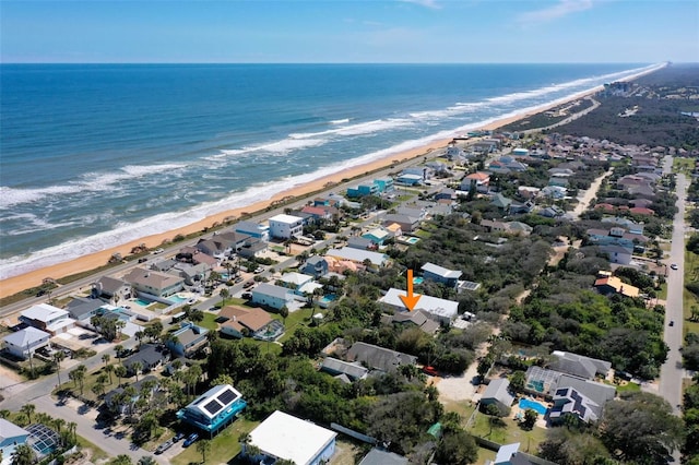 aerial view with a water view and a view of the beach