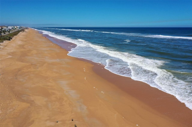 view of water feature with a beach view