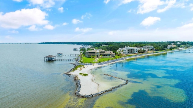 drone / aerial view featuring a view of the beach and a water view