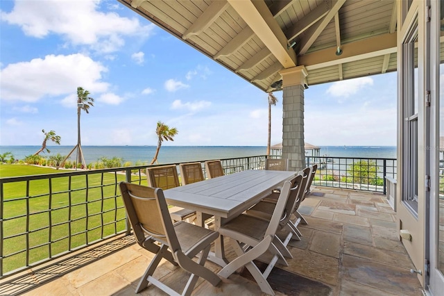 balcony featuring a water view