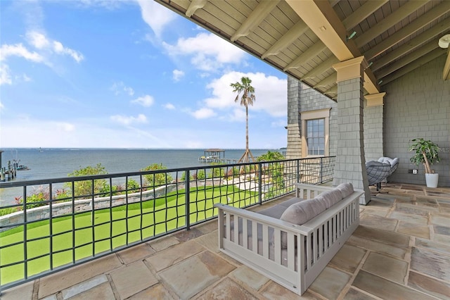 balcony featuring a water view