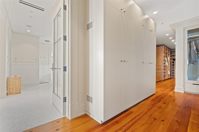 corridor with light wood-type flooring