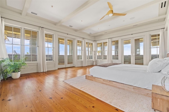 bedroom featuring beam ceiling, access to exterior, ceiling fan, and hardwood / wood-style flooring