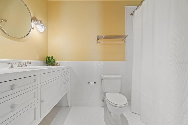 bathroom featuring vanity, a shower with curtain, tile walls, tile patterned flooring, and toilet