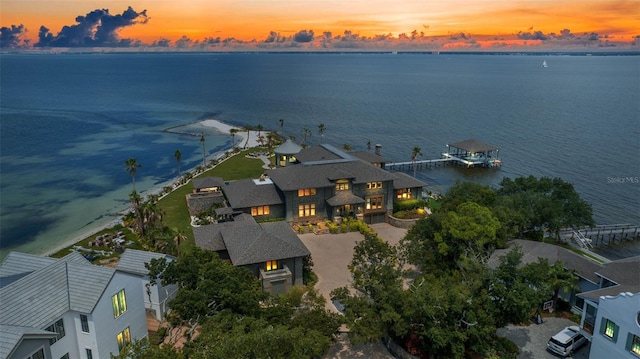 aerial view at dusk with a water view