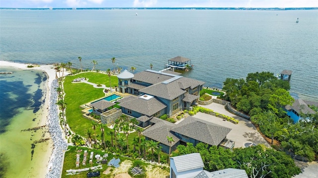 aerial view with a view of the beach and a water view