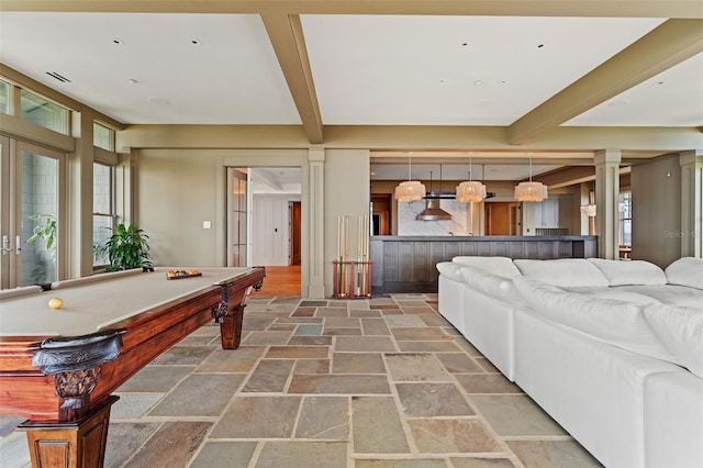 living room with beamed ceiling, billiards, and decorative columns