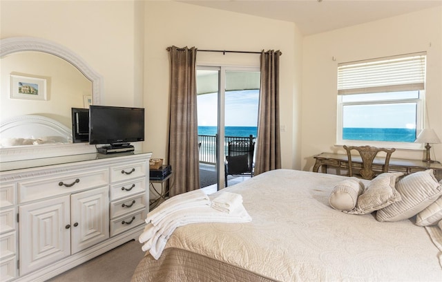 carpeted bedroom featuring access to outside