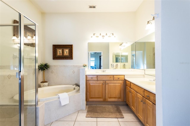 bathroom featuring tile patterned flooring, vanity, and separate shower and tub