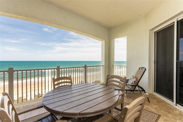 balcony with a view of the beach and a water view