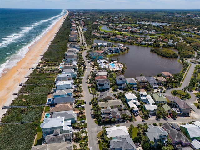 aerial view with a water view and a view of the beach