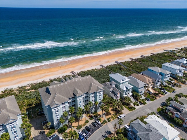 aerial view featuring a view of the beach and a water view