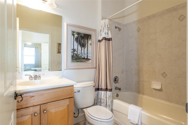 bathroom with toilet, vanity, and shower / bath combo