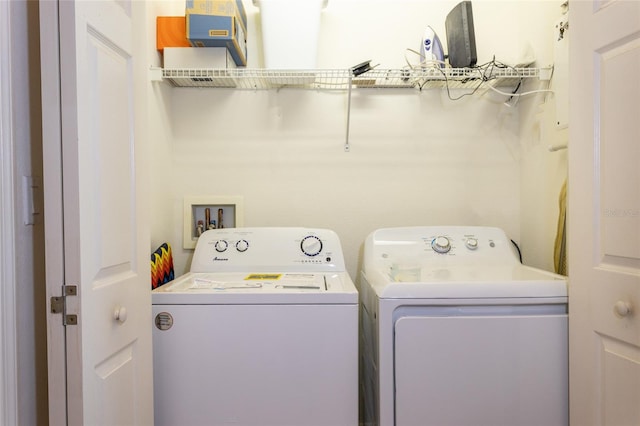 laundry area with washing machine and dryer