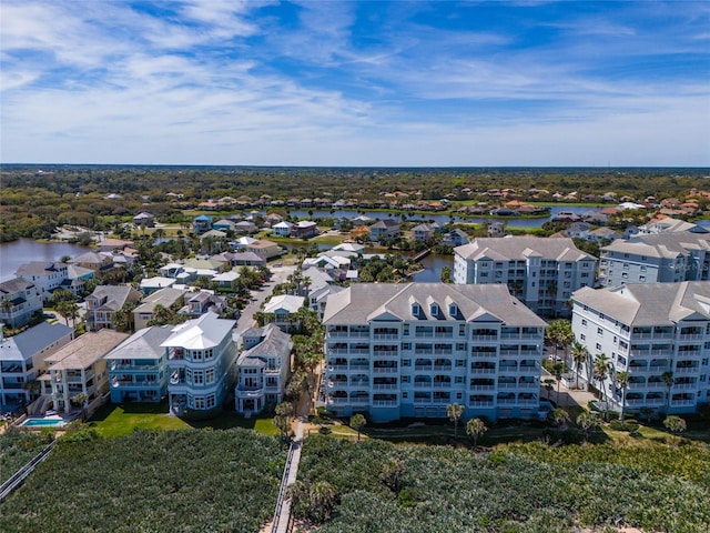 drone / aerial view with a water view and a residential view